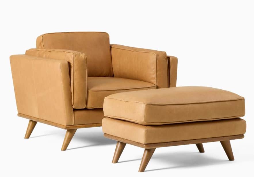A contemporary armchair and ottoman set upholstered in tan leather. The armchair features a boxy sil… — 3D model