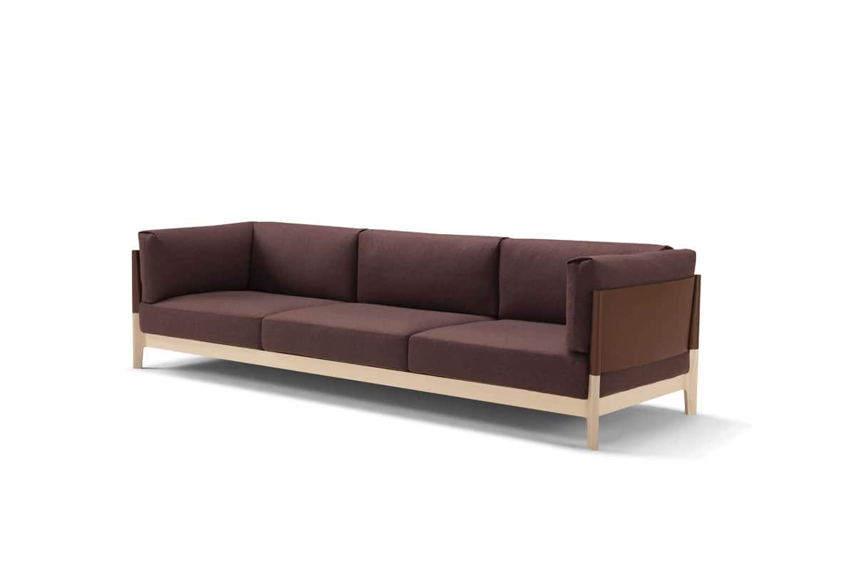 A modern three-seater sofa featuring a clean-lined wooden frame. The sofa is upholstered in a rich b… — free BLEND 3D model
