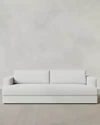 A modern, light-colored sofa featuring a clean, minimalist design with boxy track arms and plush, in… — free SKP 3D model