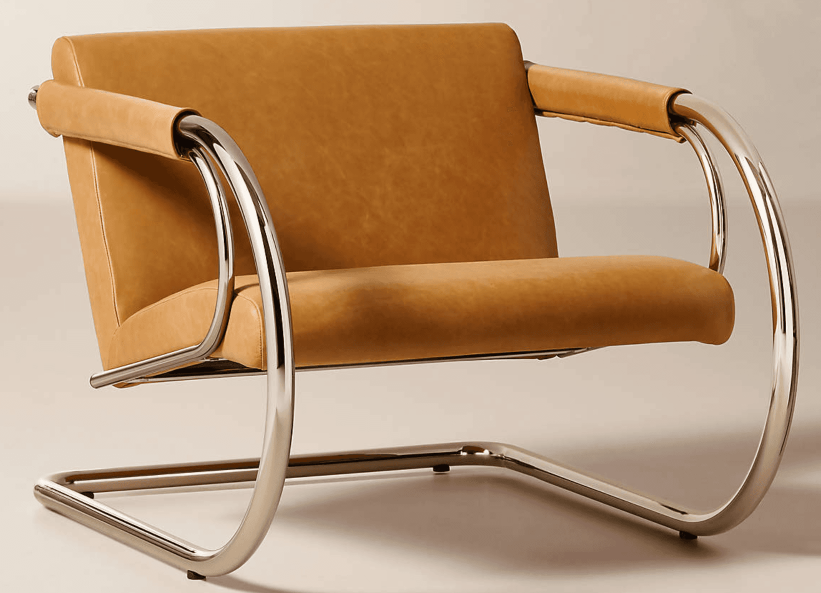 A modernist lounge chair featuring a cantilever tubular chrome frame and camel-colored leather uphol… — 3D model