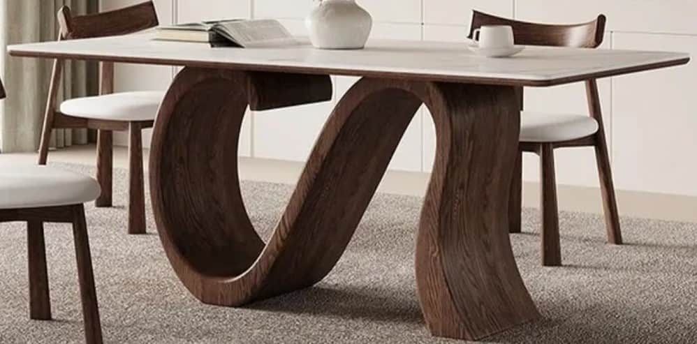 A modern rectangular coffee table featuring a white faux marble top and a unique, sculptural dark wo… — 3D model