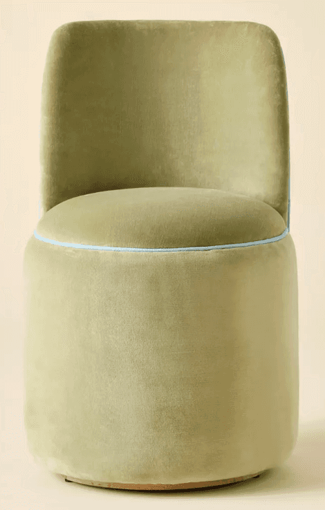 A fully upholstered accent chair featuring a low, curved backrest and a circular seat, both resting… — 3D model