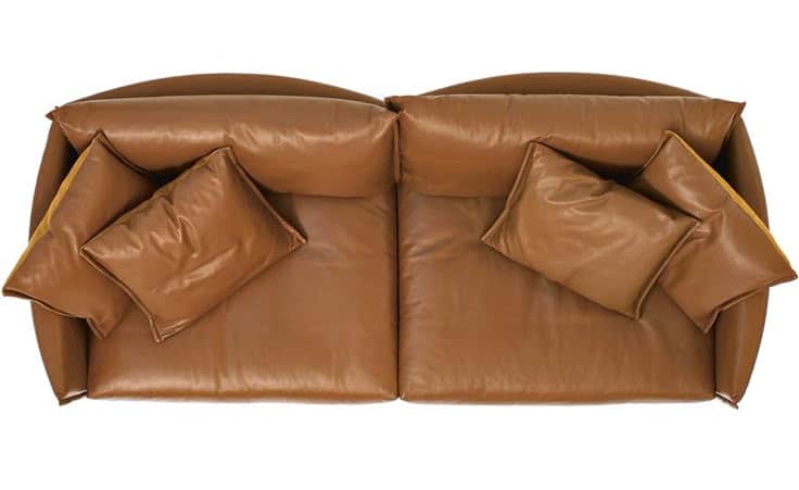 A two-seater sofa with a curved back and armrests, upholstered in brown leather. It features plush s… — 3D model
