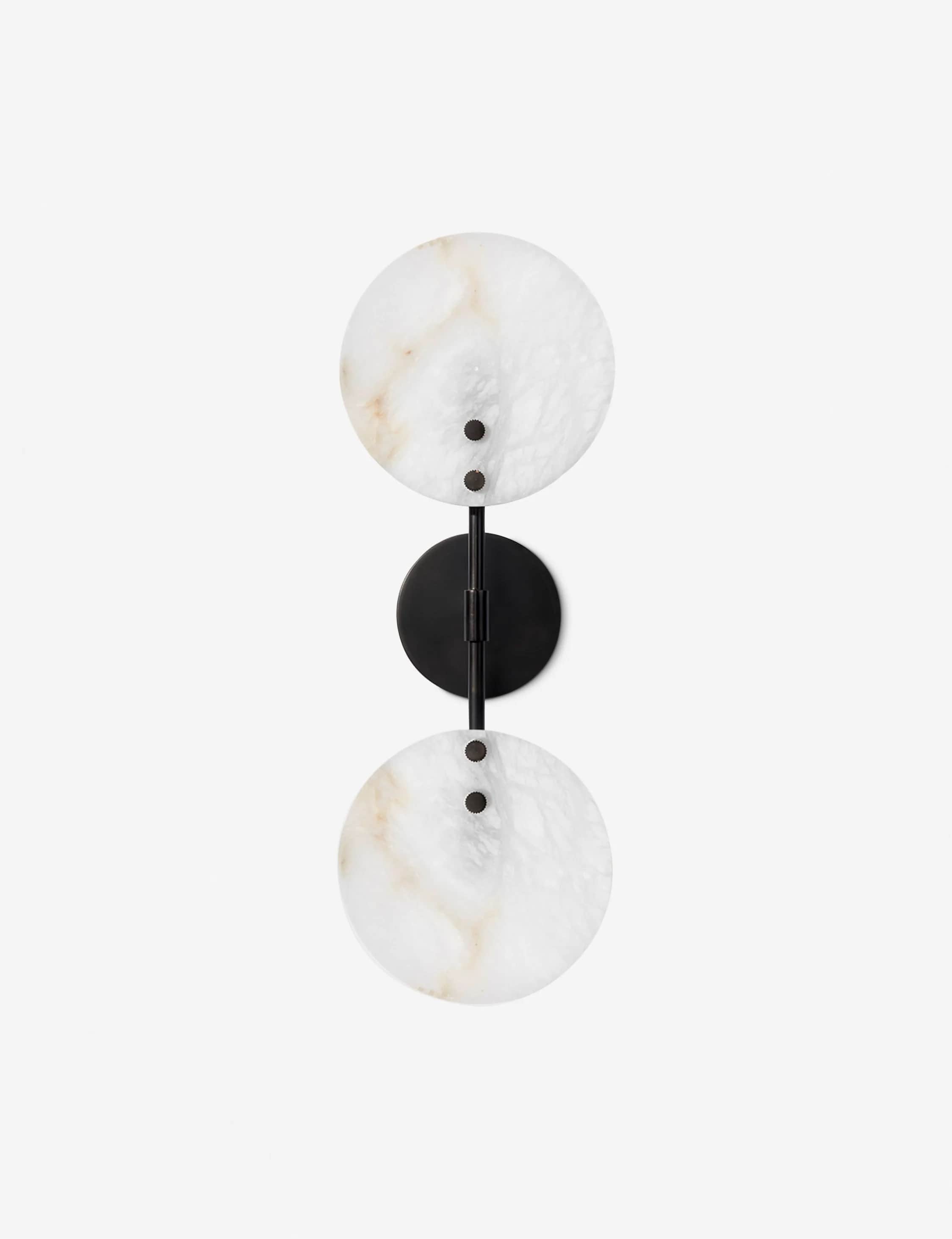 A modern wall sconce featuring two circular, translucent alabaster shades mounted vertically on a da… — 3D model