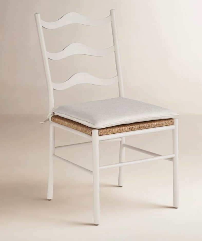 A white painted wooden chair featuring a wavy ladder-style backrest and a natural woven rush seat, t… — 3D model