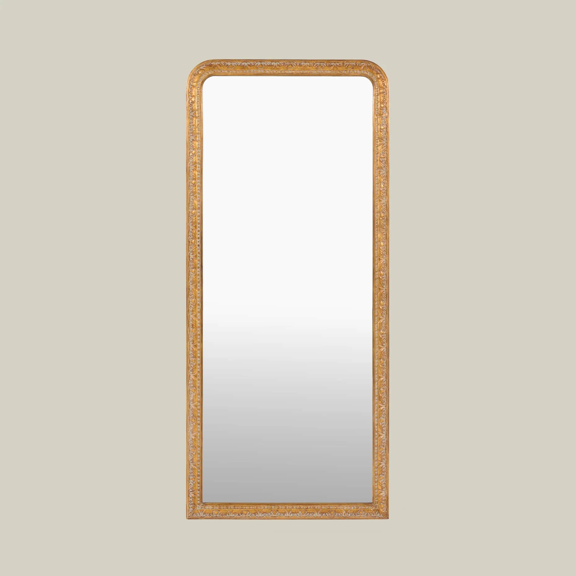 A tall, rectangular wall mirror featuring rounded top corners and an intricately carved, gilded fram… — 3D model