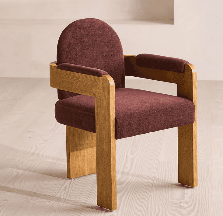 A modern armchair featuring a sturdy wooden frame and rich burgundy upholstery. The design incorpora… — 3D model