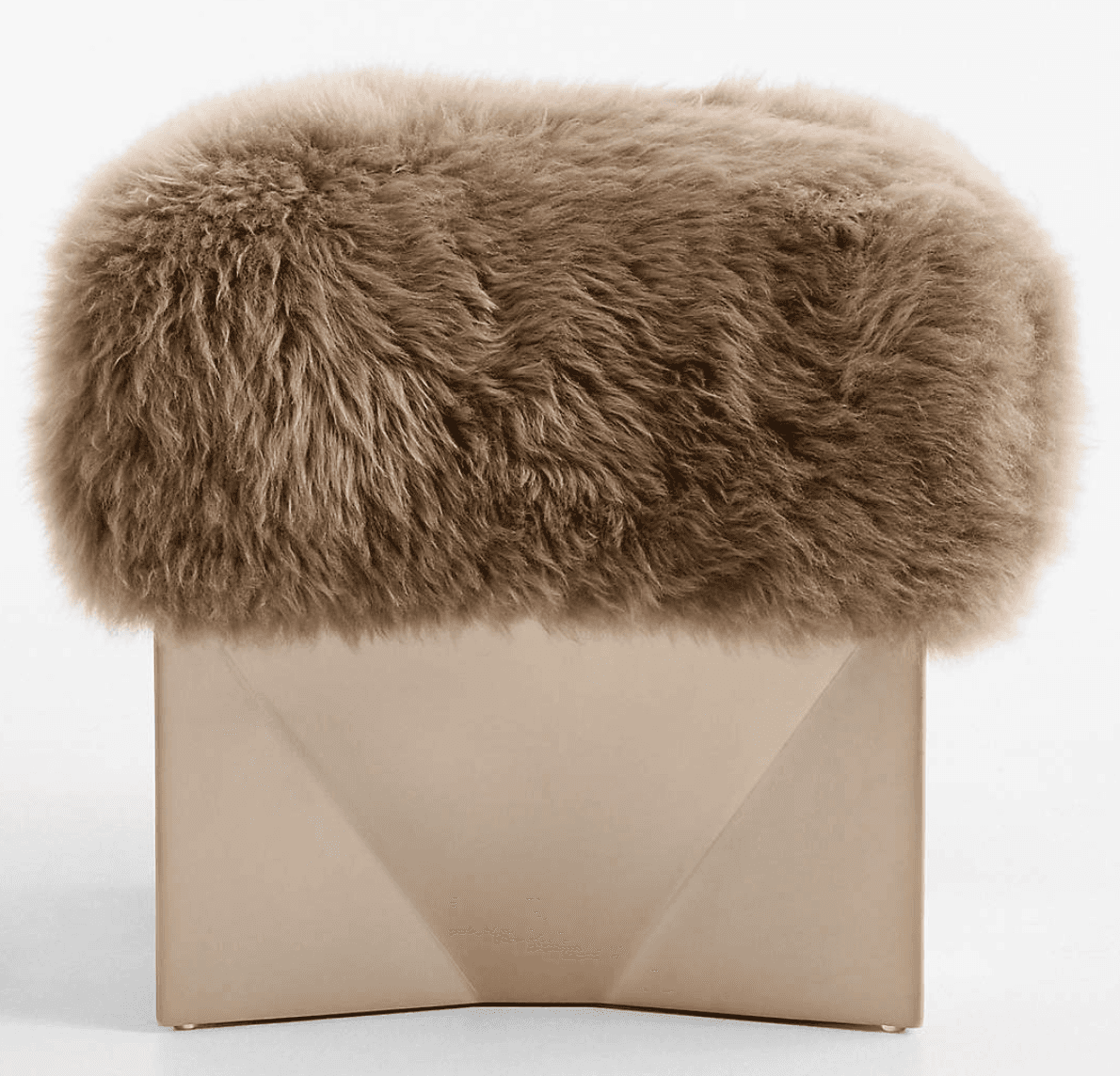 A modern ottoman featuring a textured, fur-like upholstered top and a geometric base. The top is rou… — 3D model