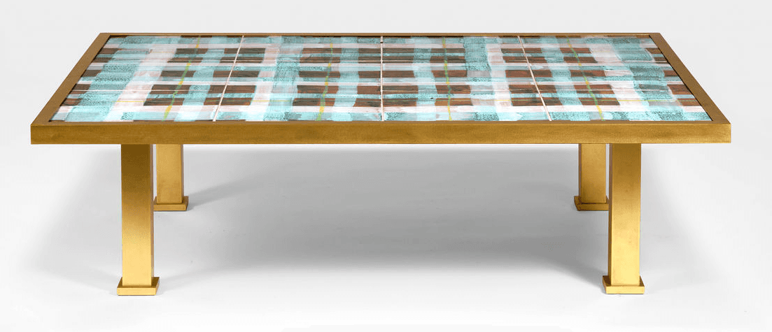 A rectangular coffee table with a gold-toned metal frame and legs. The tabletop features a decorativ… — 3D model