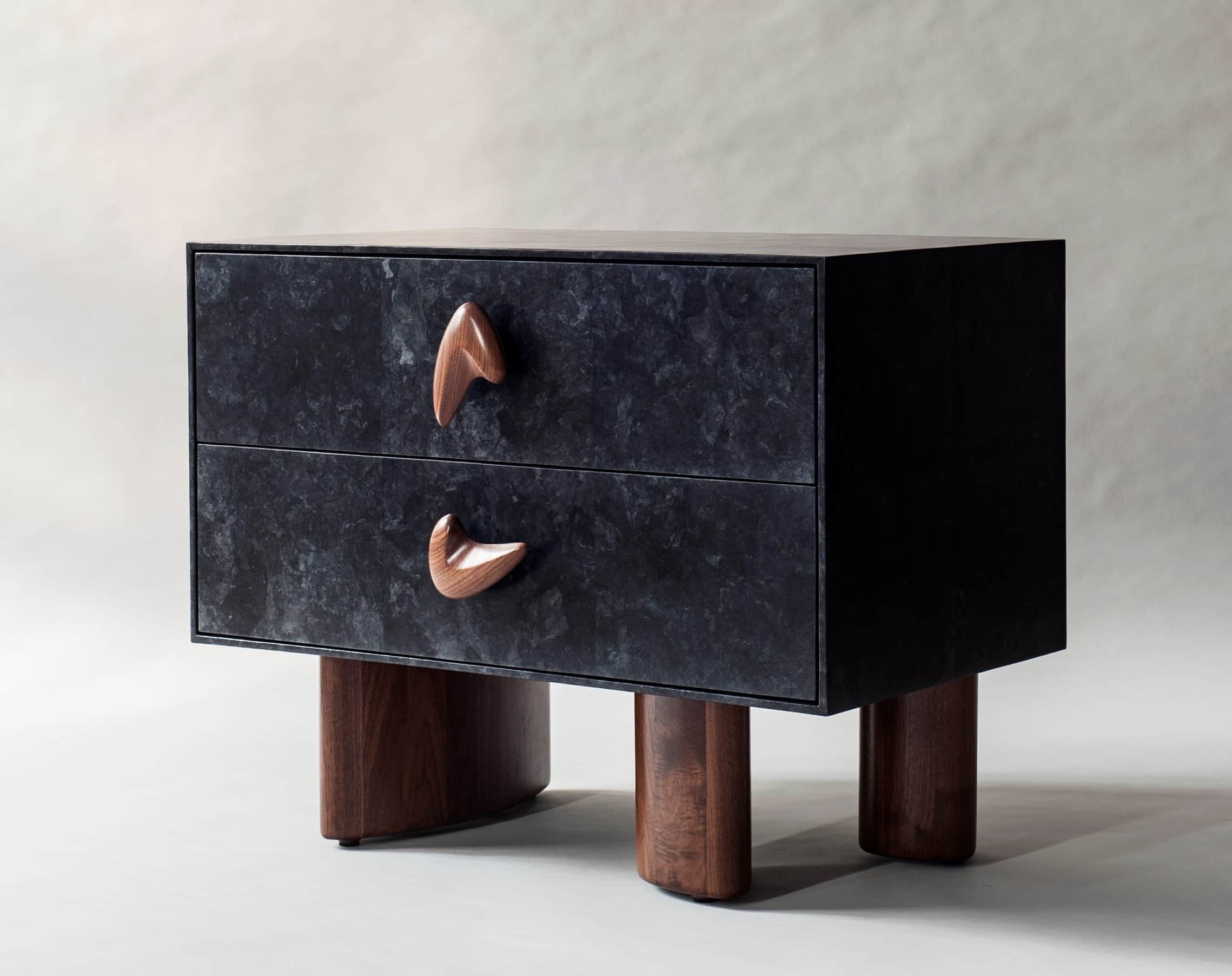 A contemporary nightstand featuring a dark, textured exterior with two drawers. Each drawer is adorn… — 3D model