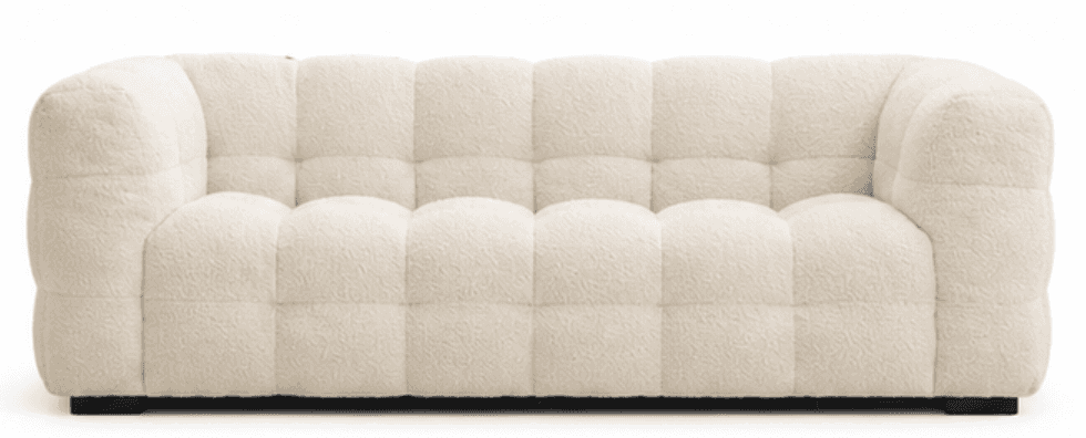 A modern three-seater sofa upholstered in a creamy, off-white boucle fabric. The sofa features a dis… — free SKP 3D model
