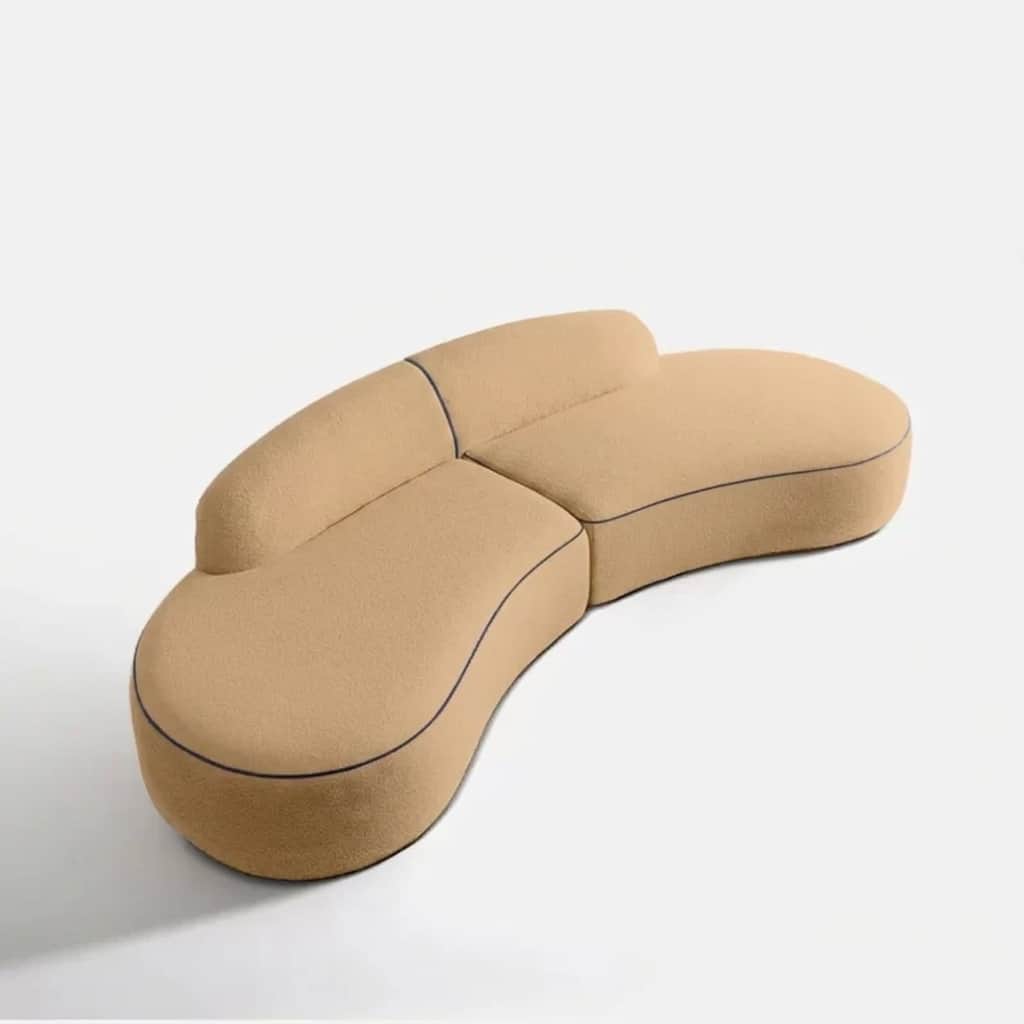 A modern, modular sectional sofa with a distinctive biomorphic, curved design, upholstered in a text… — 3D model