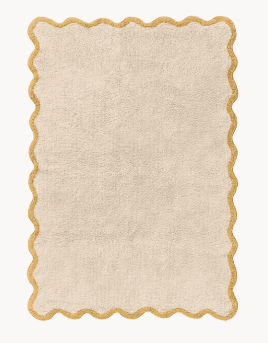 A rectangular area rug featuring a cream-colored, textured pile surface and a distinctive scalloped… — 3D model