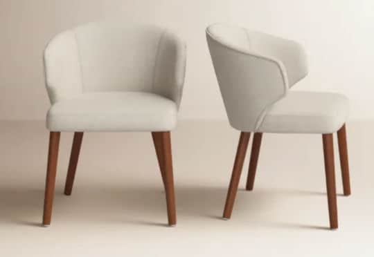 A contemporary upholstered armchair featuring a continuous, curved backrest that seamlessly transiti… — 3D model