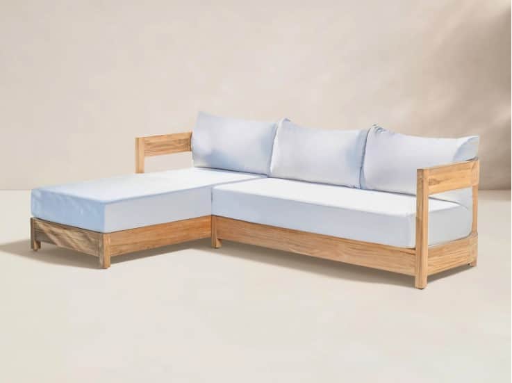 A sectional sofa with a chaise lounge extension. The frame is constructed from light-colored wood wi… — 3D model