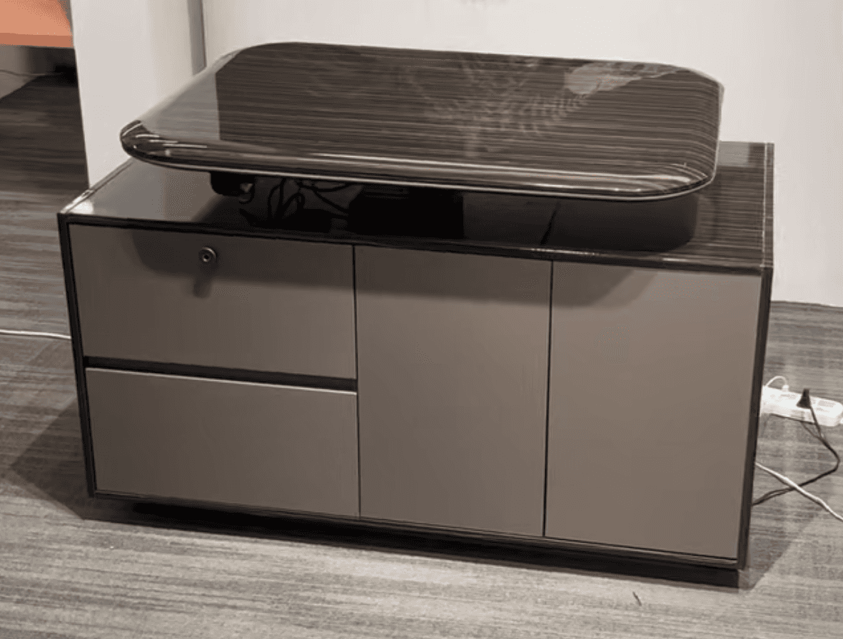 A modern credenza featuring a dark wood veneer finish on its main body and a contrasting matte grey/… — 3D model
