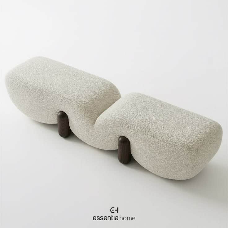 A modern, sculptural bench featuring a wavy, organic form, upholstered in light-colored boucle fabri… — 3D model