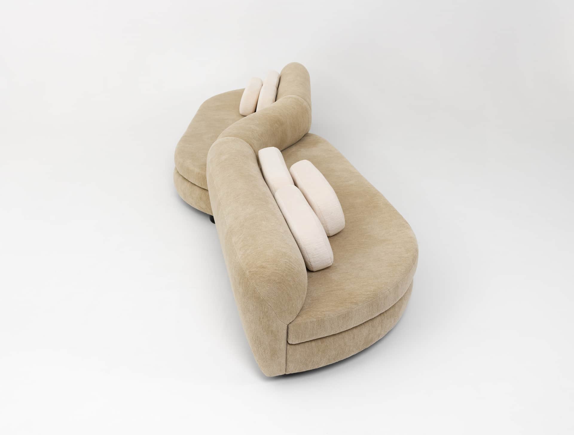 A contemporary curved modular sectional sofa upholstered in a beige, textured fabric. The sofa featu… — 3D model