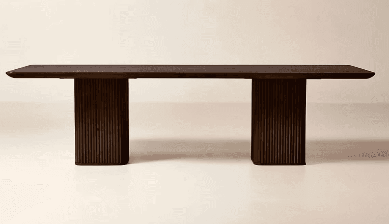 A rectangular dining table crafted from dark wood, featuring a thick, smooth tabletop. The table is… — 3D model