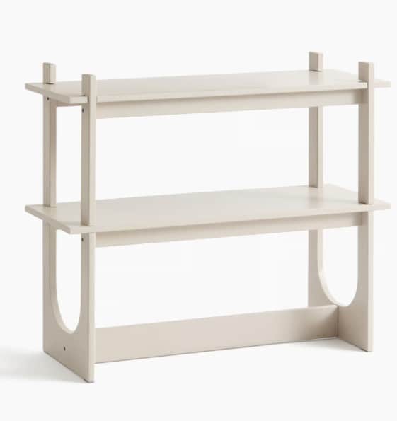 A minimalist two-tier shelving unit with a light beige painted finish, featuring integrated vertical… — 3D model