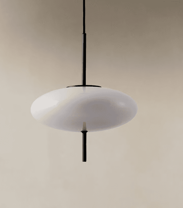A modern pendant light featuring a large, horizontally oriented ovoid diffuser made of opaque white… — 3D model