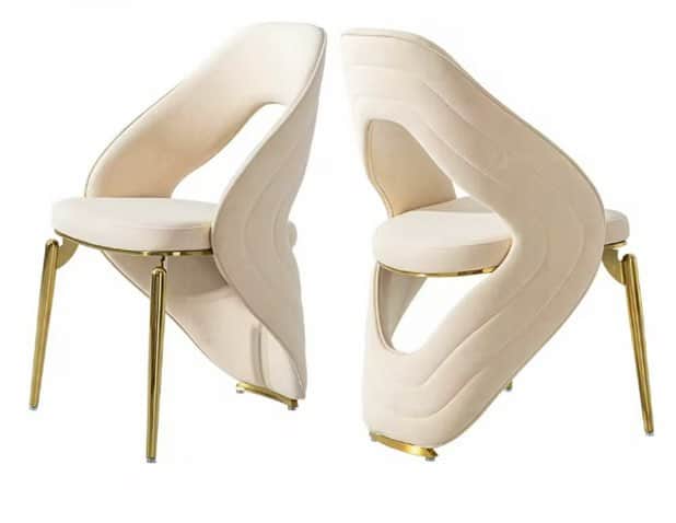 A contemporary armless chair featuring an upholstered, sculptural backrest with a distinctive cut-ou… — 3D model
