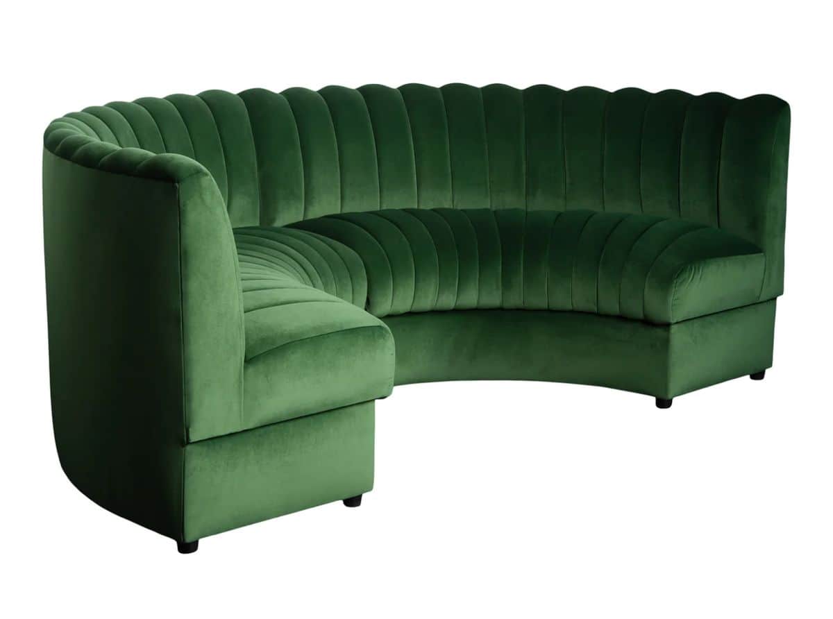 An emerald green velvet sectional sofa with channel tufting, featuring a primary curved section and… — 3D model