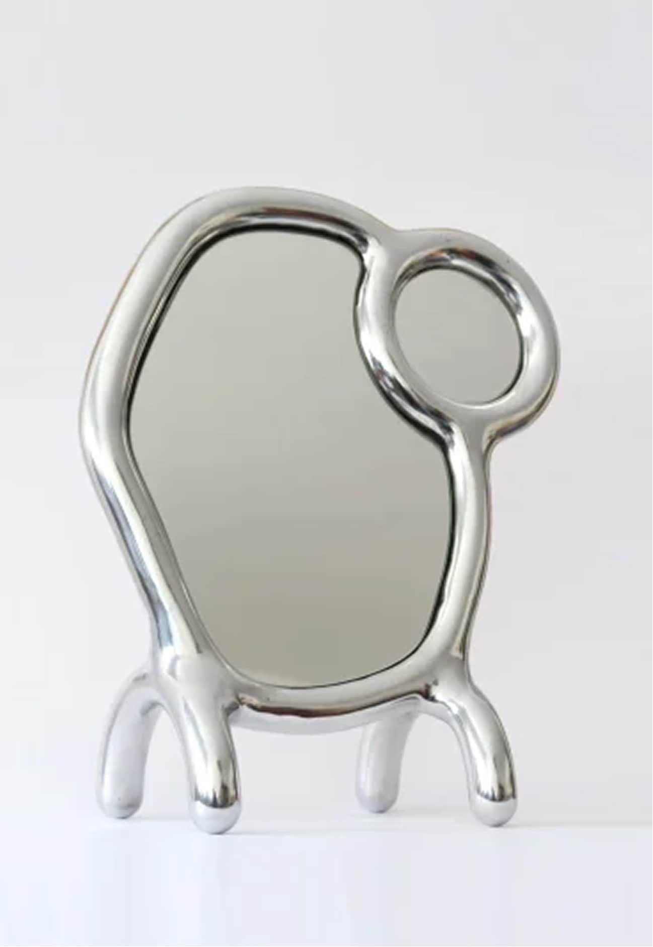 This is a unique, sculptural table mirror with an avant-garde design. It features a large, irregular… — 3D model