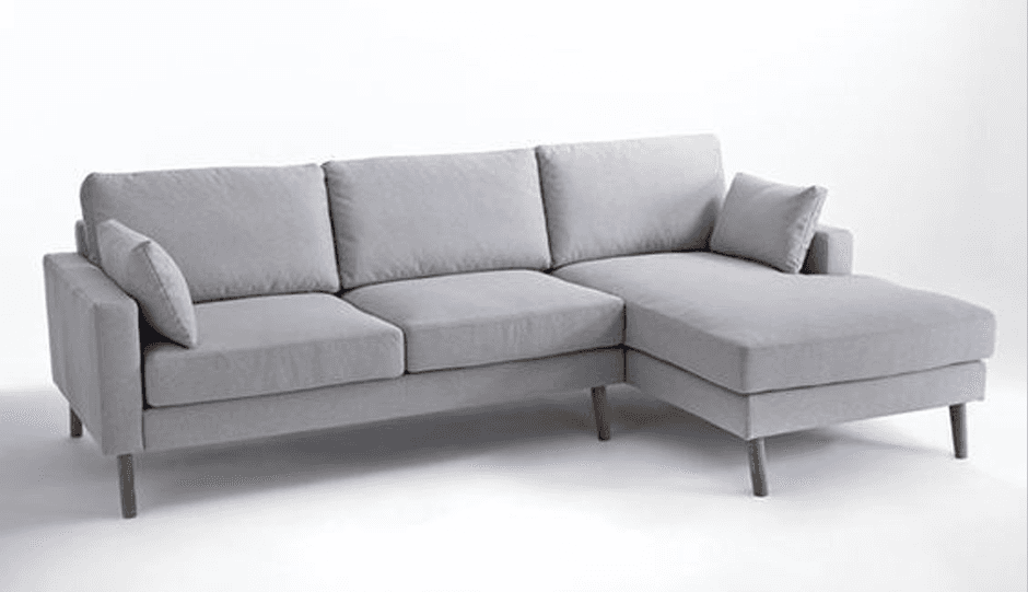 A contemporary sectional sofa upholstered in light grey fabric, featuring a three-seat main section… — 3D model