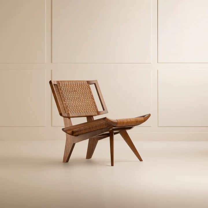 A low-profile lounge chair featuring a light-toned wooden frame and a seat and backrest crafted from… — 3D model
