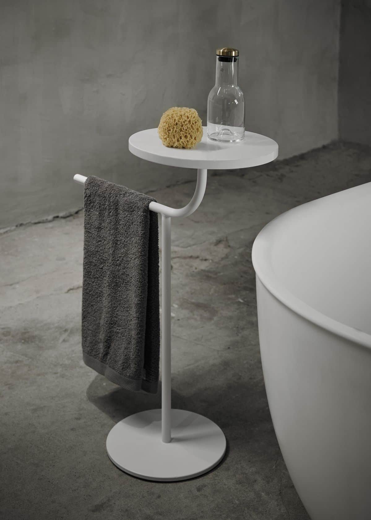 A minimalist white pedestal accent table featuring a round tabletop, a slender central column, and a… — 3D model