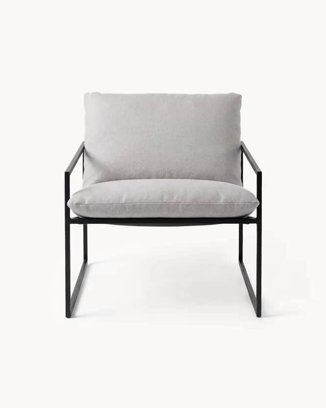 A contemporary armchair with a minimalist design. It features a thin, dark metal frame that forms th… — free OBJ 3D model