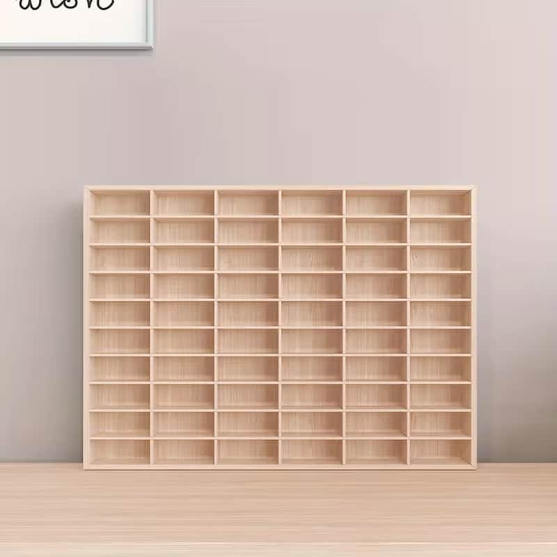 A light wood modular storage unit featuring 35 open square cubby compartments arranged in a 7x5 grid… — 3D model