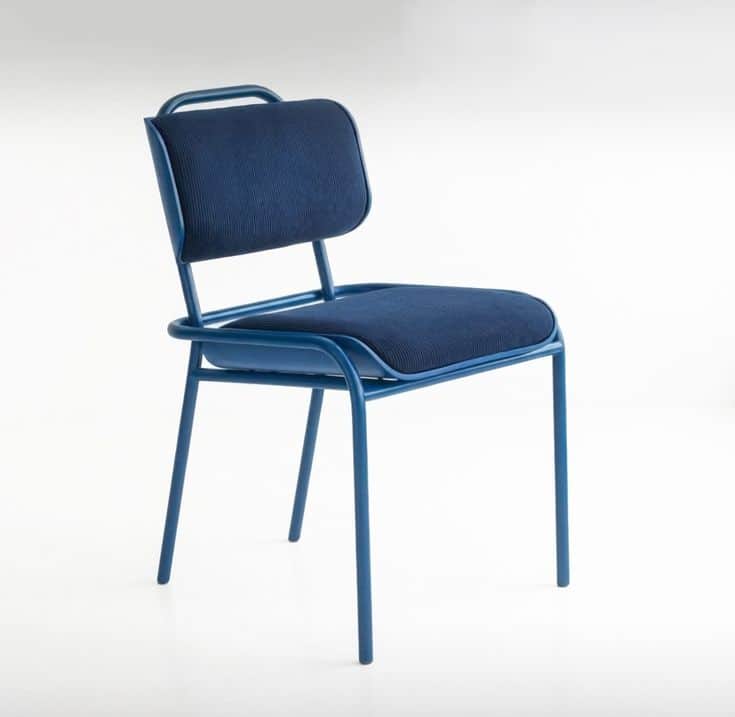 A contemporary dining chair featuring a tubular metal frame with a matte blue finish, complemented b… — 3D model