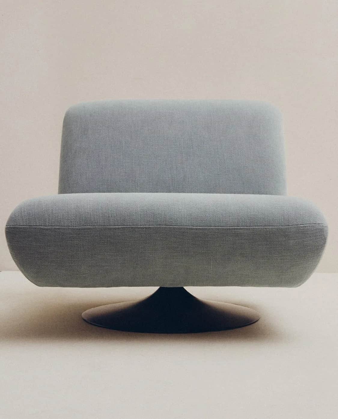 A contemporary swivel lounge chair with a low profile and rounded, organic forms. It features light… — free OBJ 3D model