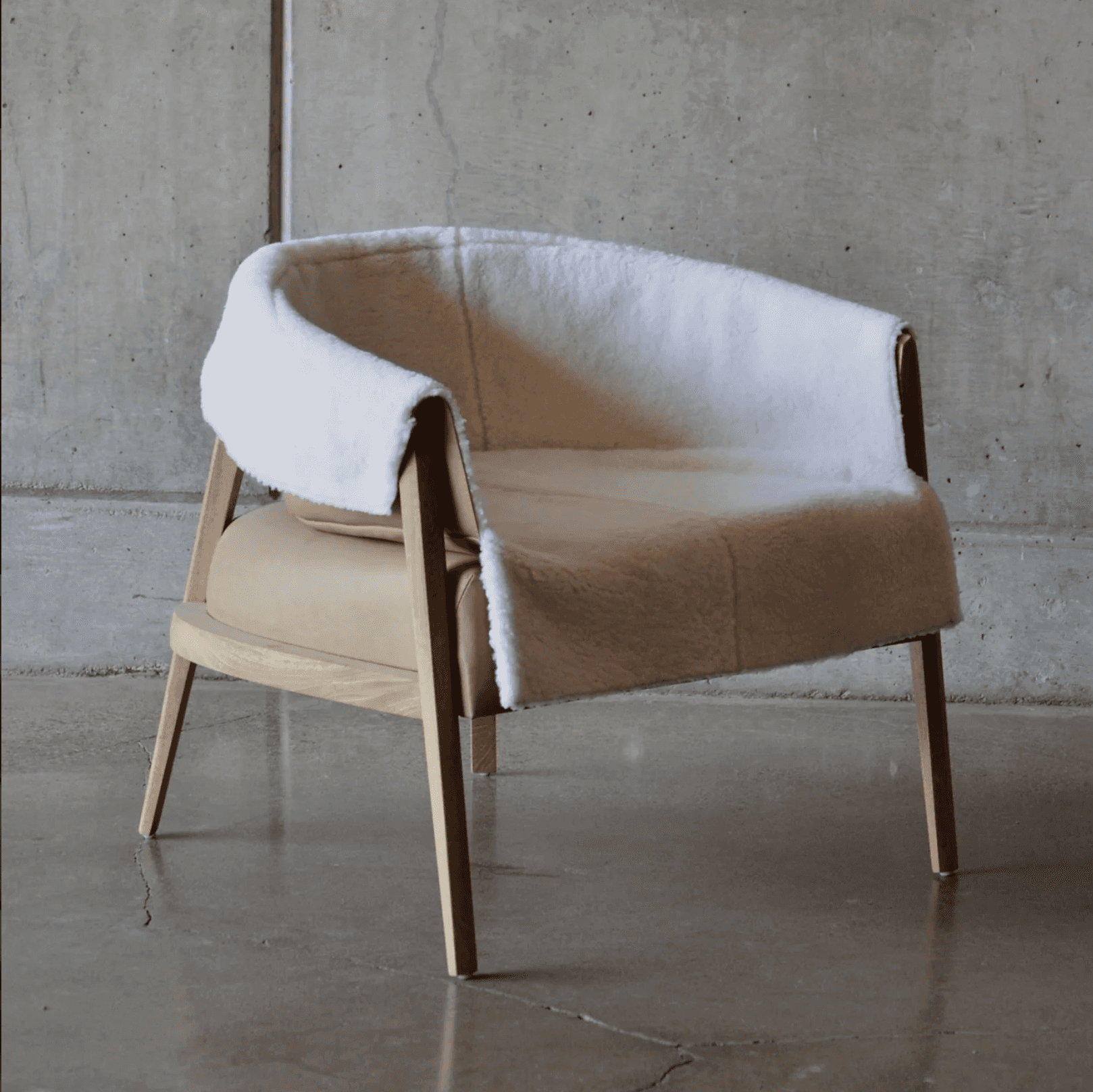 A contemporary armchair with a distinctive silhouette. The frame is constructed from light-colored w… — free OBJ 3D model