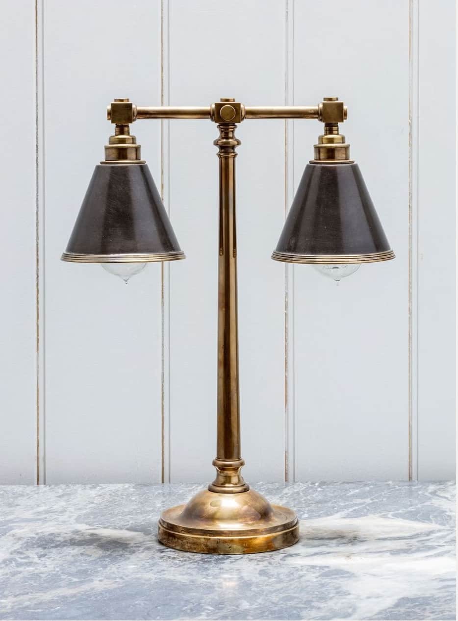 A double-headed table lamp with a brass base and stem, supporting two dark conical lampshades. The a… — free OBJ 3D model