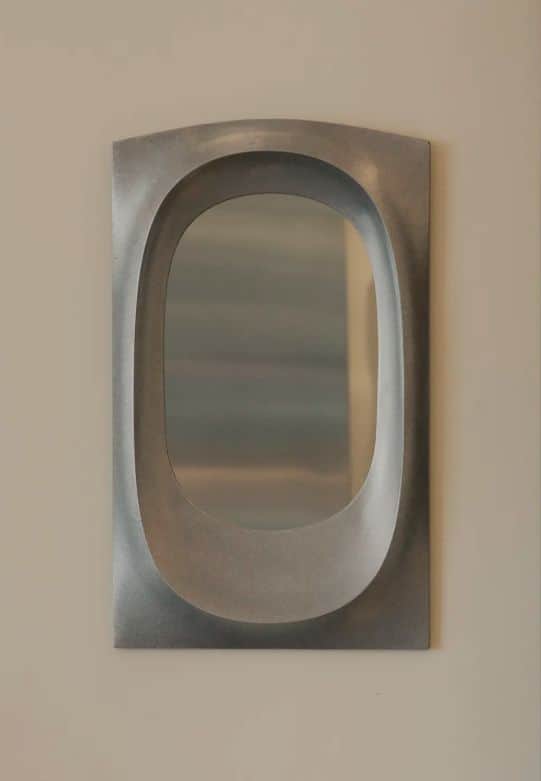 A rectangular wall mirror featuring a deep, organically shaped recessed opening for the reflective s… — free GLB 3D model