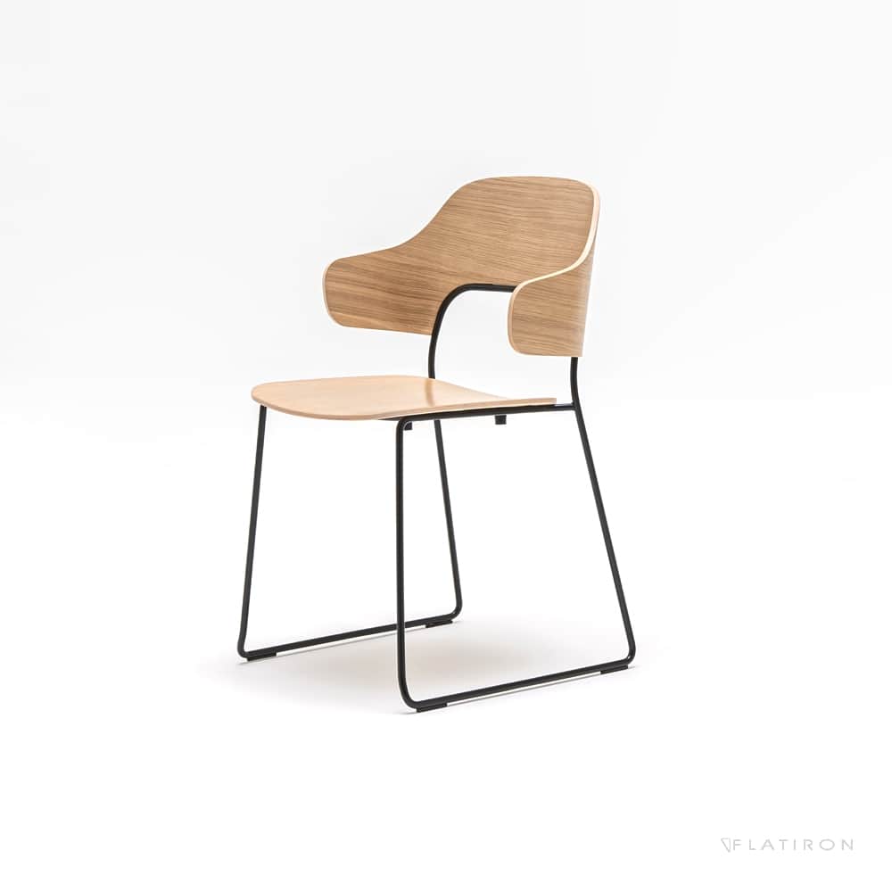 A modern dining chair with a bentwood seat and backrest supported by a black metal frame. The chair… — 3D model