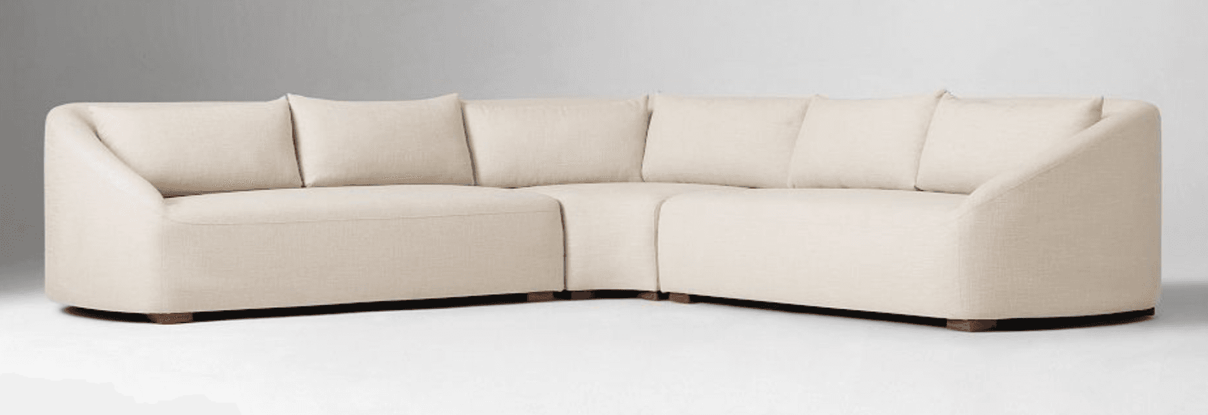 A sectional sofa composed of multiple modules, featuring a cream-colored linen-like upholstery. The… — 3D model