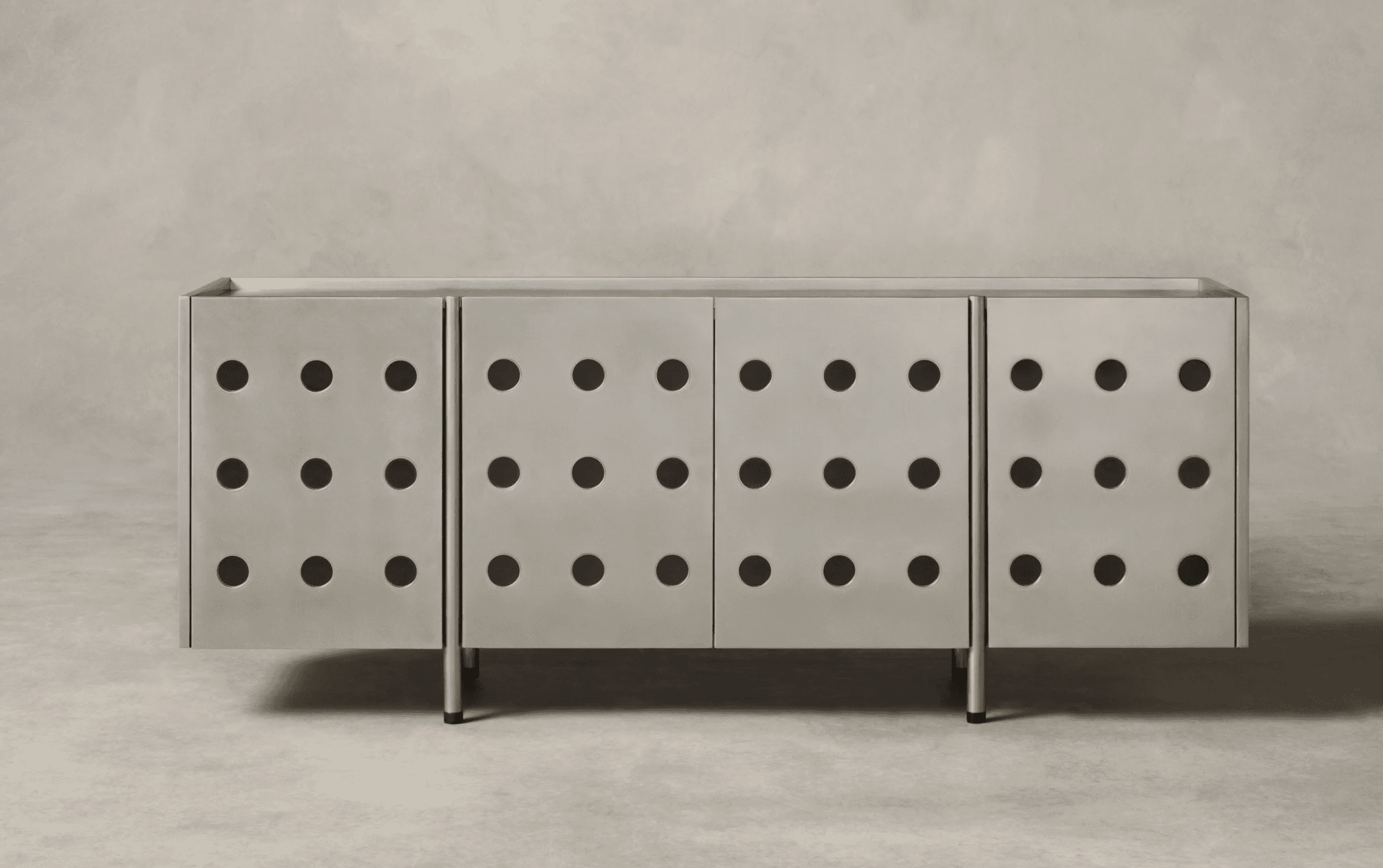 A modern sideboard with a brushed metal finish and a grid of circular perforations on each of its fo… — 3D model