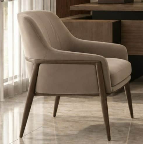 A modern upholstered accent armchair featuring a minimalist design. The chair has a comfortable, wel… — 3D model