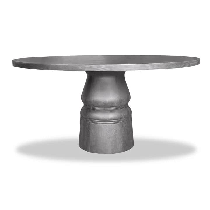 A round dining table featuring a thick, smooth circular top supported by a substantial, sculptural p… — free OBJ 3D model