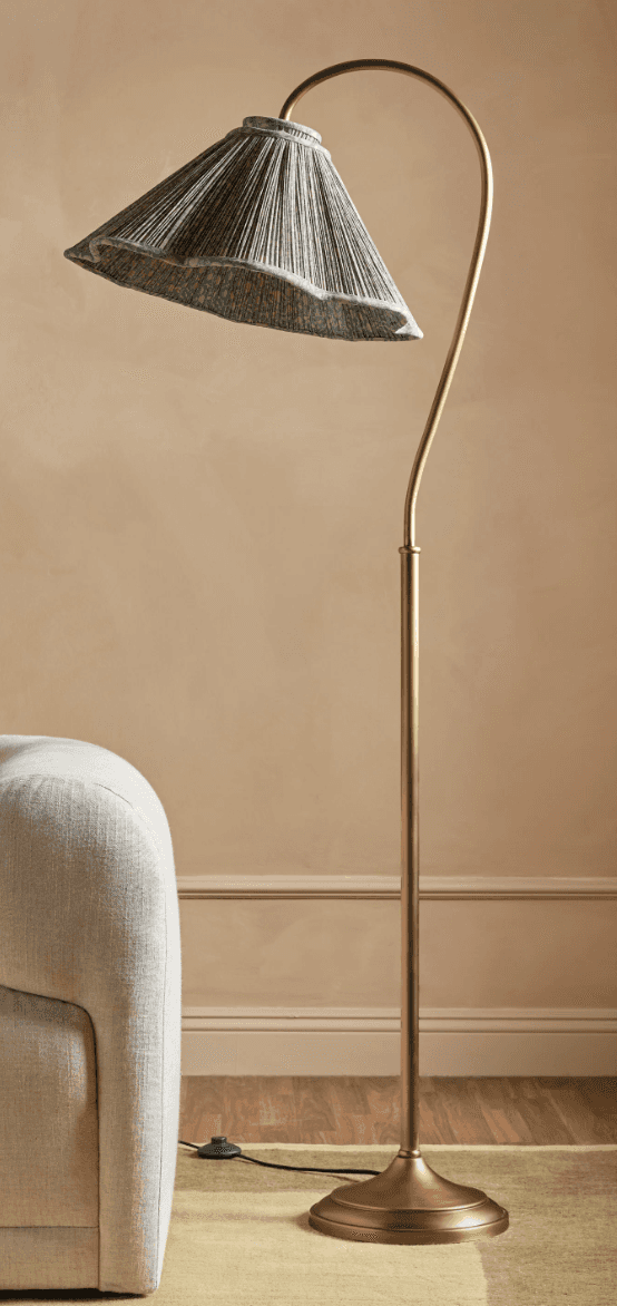 An elegant floor lamp featuring an antique brass finish, a slender, curved arc arm, and a pleated co… — 3D model