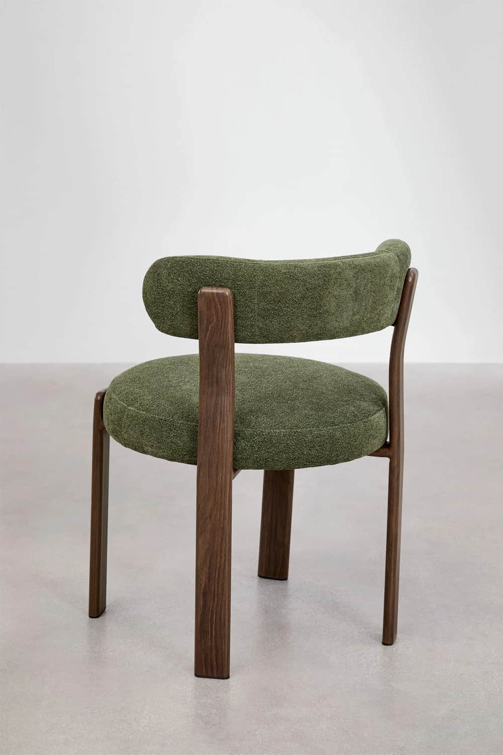 A contemporary chair featuring a dark wood frame and green upholstered seat and back. The backrest i… — 3D model