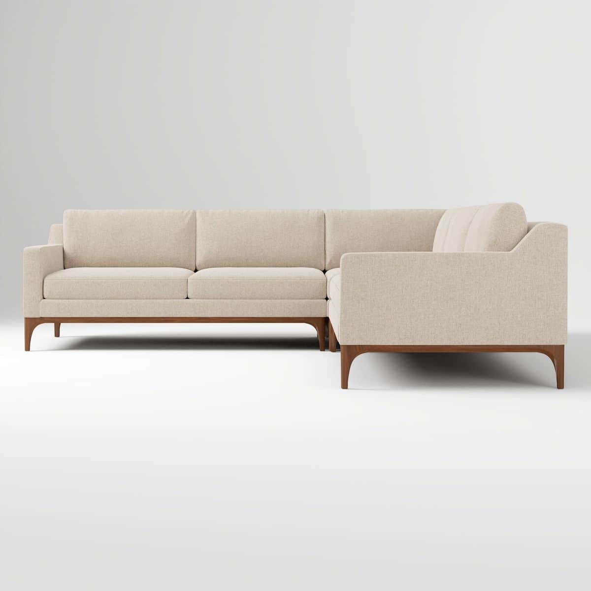 An L-shaped sectional sofa featuring light-colored fabric upholstery and an exposed dark wood base w… — 3D model