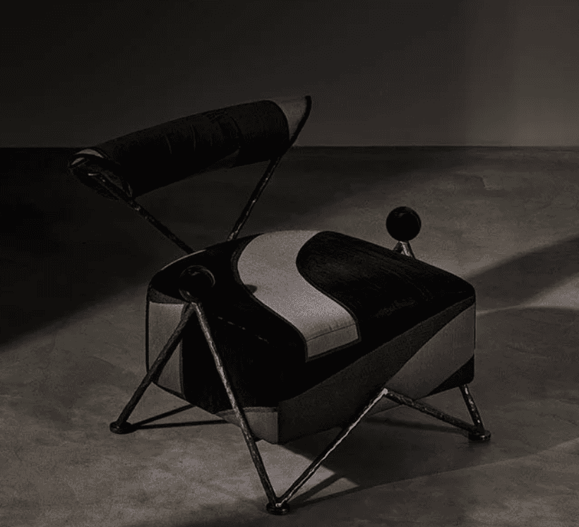 An Art Deco-inspired lounge chair featuring a plush upholstered seat and backrest, supported by an i… — 3D model