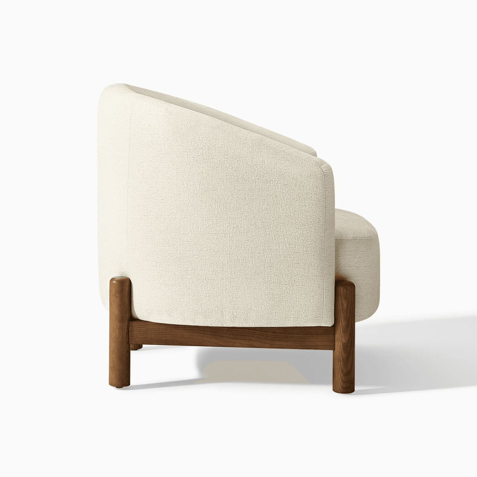 A modern armchair upholstered in a textured, light-colored fabric. It features a gently curved backr… — free OBJ 3D model