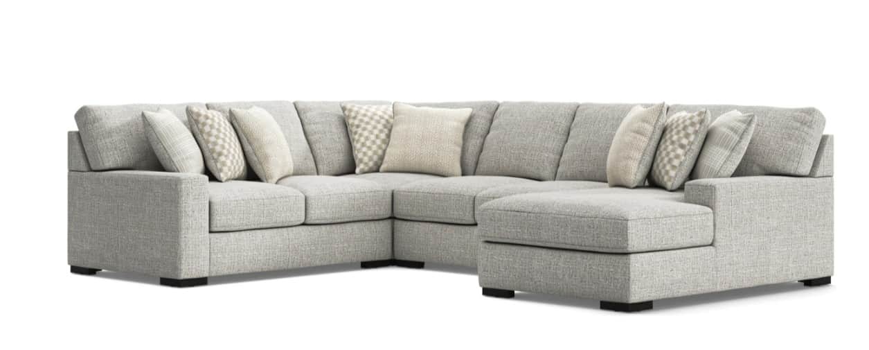 An L-shaped sectional sofa with a right-hand facing chaise, upholstered in a light gray textured fab… — 3D model