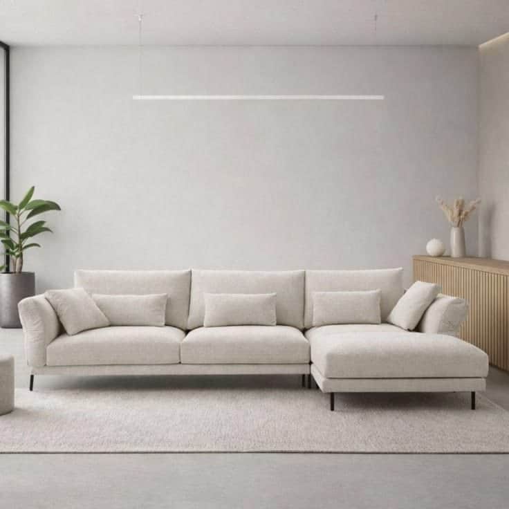 A modern L-shaped sectional sofa featuring an integrated chaise lounge, upholstered in a light beige… — free SKP 3D model